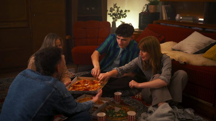 Laughter And Pizza At A Cozy Friends' Night In