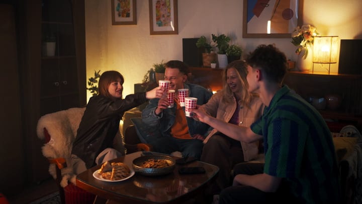 Laughter And Warmth At A Cozy Evening Gathering
