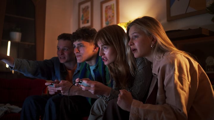 Friends Immersed in a Thrilling Video Game Night