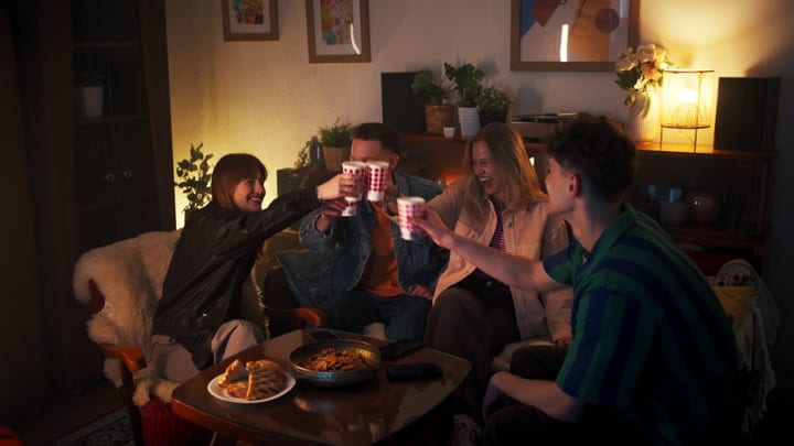 Warm Laughter And Toasts In A Cozy Living Room