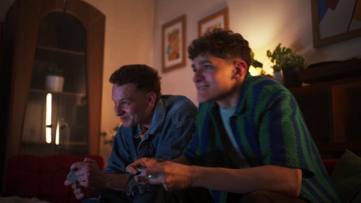 Friends Immersed in a Joyful Gaming Night