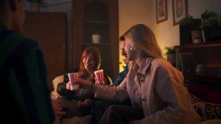 Laughter Echoes In A Cozy Evening Gathering