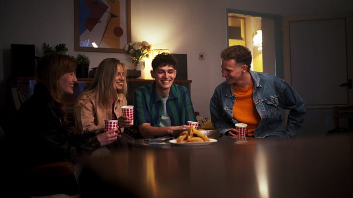 Laughter and Warm Drinks With Friends Indoors