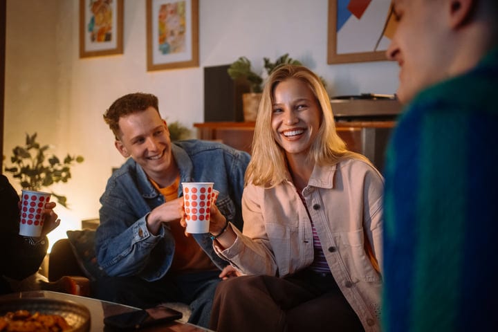 Laughter and Connection Over Warm Drinks at Home