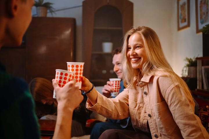 Joyful Toasts and Laughter at a Cozy Gathering