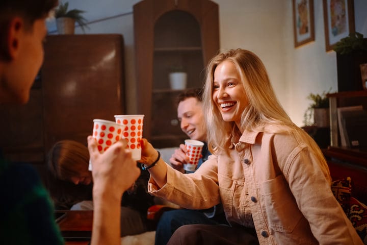Laughter and Warmth Fill the Cozy Living Room Gathering