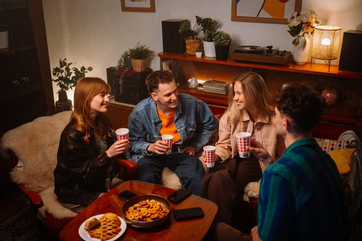Laughter Fills the Room at a Cozy Friends Gathering