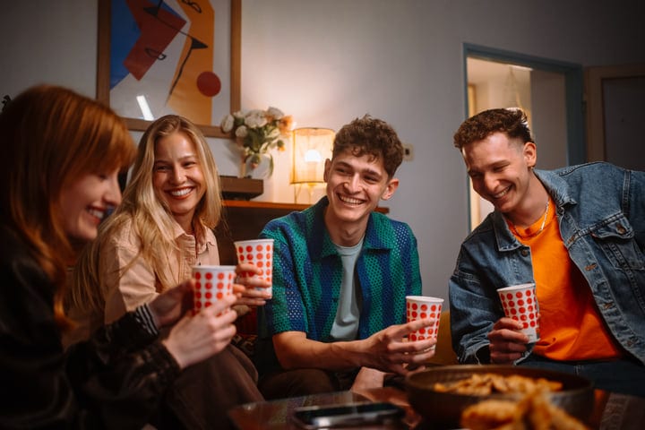 Laughter and Warmth Fill a Cozy Living Room Gathering