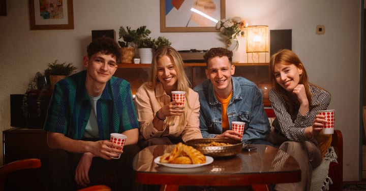 Young Friends Share Joyful Moments in a Cozy Living Room