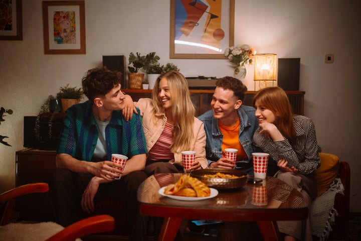 Laughter and Conversations Over Warm Drinks Indoors