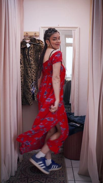 Joyful Moment As Friend Twirls In Boutique Fitting Room