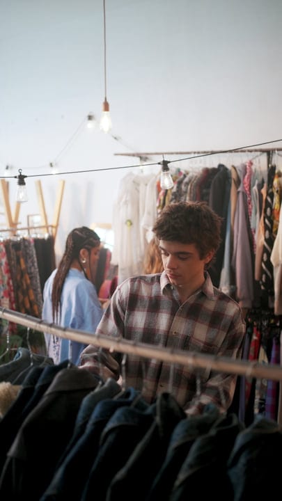 Browsing Through Vintage Finds In A Cozy Boutique