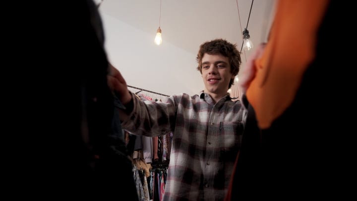 Young Shopper Delights In Boutique Fashion Discovery