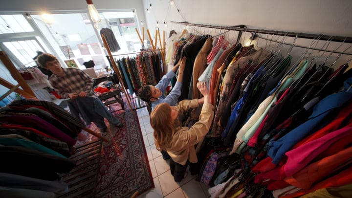 Joyful Friends Explore Unique Finds In A Trendy Boutique