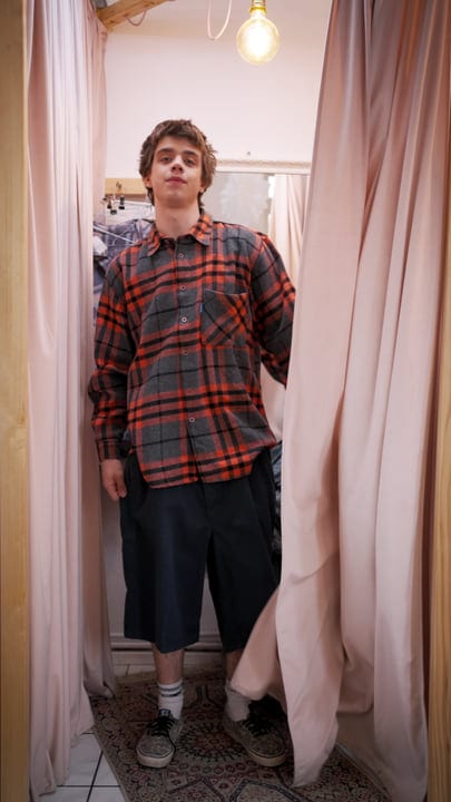 Young Shopper Embraces Fashion In Boutique Fitting Room