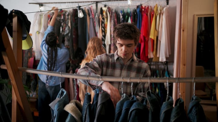Young Adults Explore Fashion Finds In Cozy Boutique