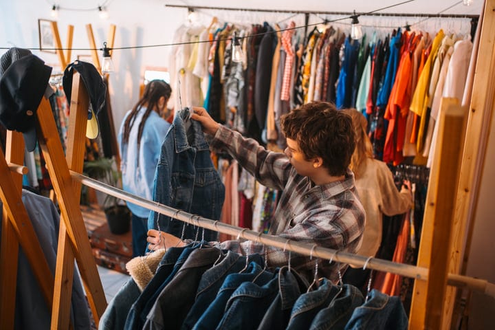 Friends Explore Vintage Denim In Cozy Boutique Setting