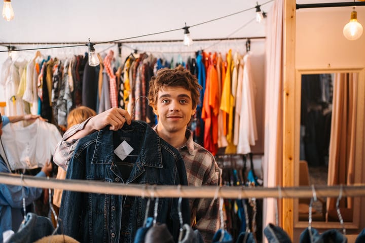 Joyful Friends Exploring Fashion in a Cozy Boutique