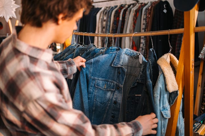 Young Shopper Delights In Denim Finds At Boutique