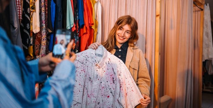 Young Woman Finds Unique Shirt While Shopping