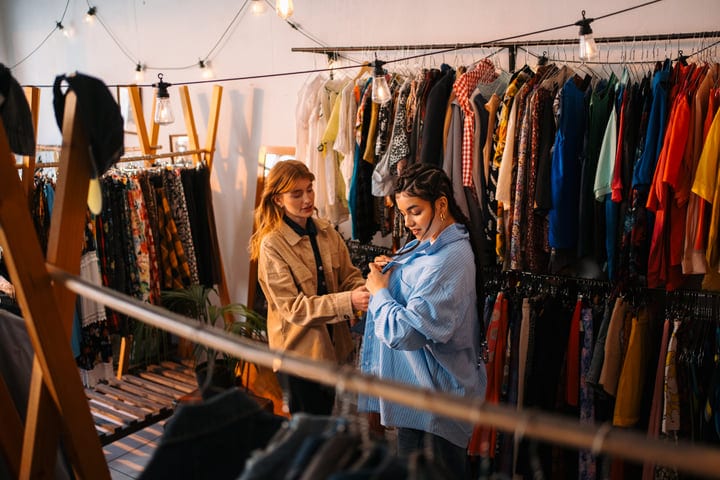 Friends Explore New Styles In A Cozy Boutique Setting