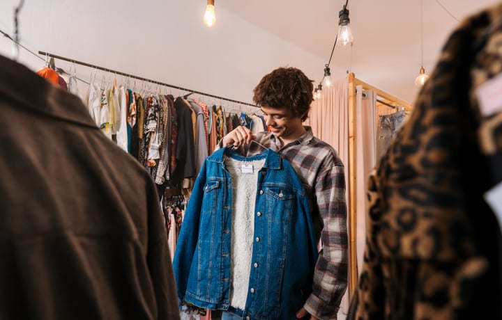 Joyful Youth Examines Denim Jacket In Boutique Setting
