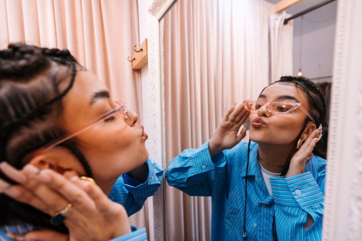 Reflection Of Style: Trying On Sunglasses In Boutique