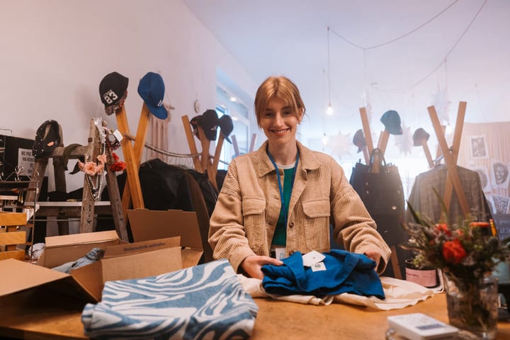 Warm Smiles and Cozy Layers in Boutique Shopping