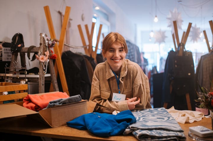 Bright Smiles Amidst Cozy Boutique Textiles Display
