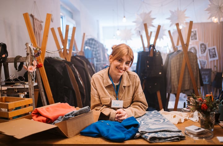 Warm Smiles and Cozy Fabrics in a Boutique Setting