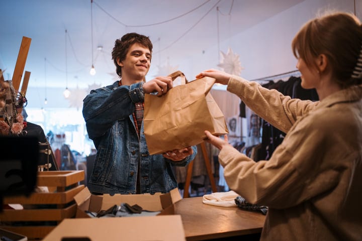 Friends Enjoy a Spontaneous Shopping Spree in Cozy Boutique