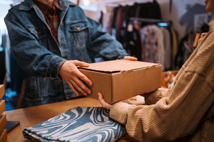 Exchanging Smiles Over A Boutique Box With Friends