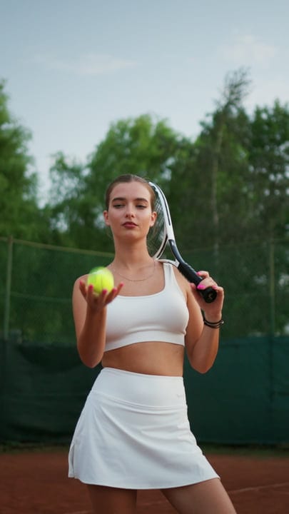 Young Woman Holding Tennis Ball And Racket, Ready To Play