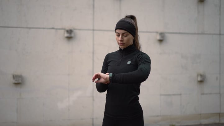 Focused Jogger Sets Her Pace With Smartwatch Outdoors