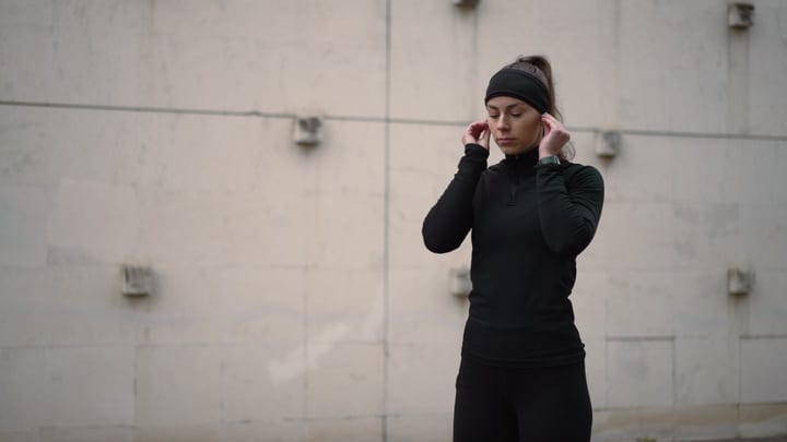 Focused Jogger Prepares for a Chilly Autumn Run