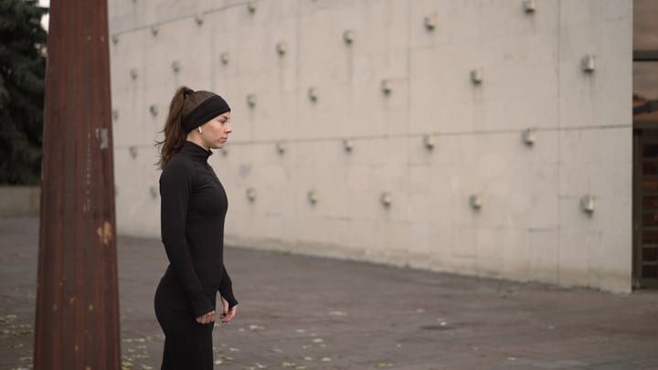 Determined Woman Prepares for Autumn Jogging Session