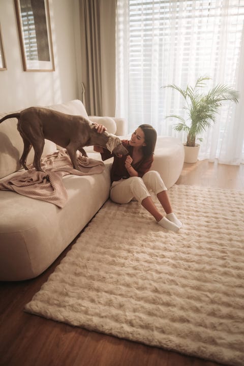 Morning Companionship: A Cozy Start With Her Dog