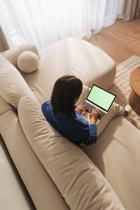 Morning Sunlight And Digital Connection On A Cozy Sofa