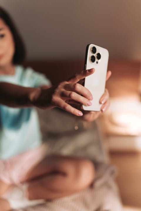 Woman Using Smartphone To Record Her Morning Routine Indoors