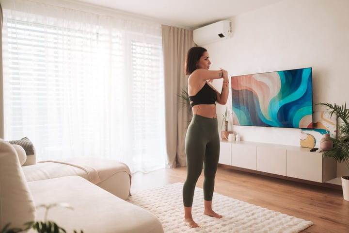 Morning Stretching Ritual In A Sunlit Living Space