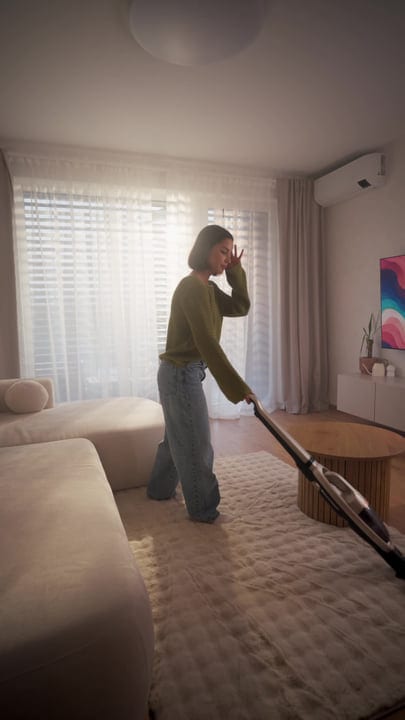 A Young Woman Cleans Her Modern Living Room With A Stick Vacuum