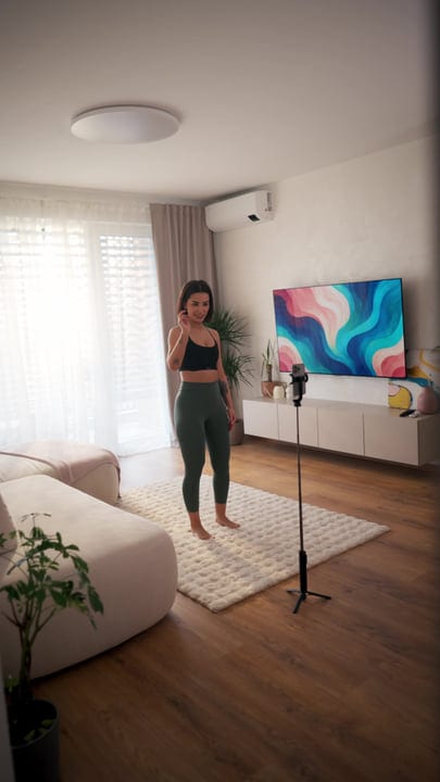 Young Woman Applies Facial Massager During Her Morning Skincare Routine At Home