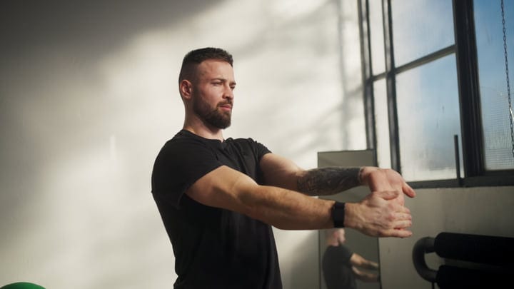Focused Man Engages In Morning Yoga Routine Indoors