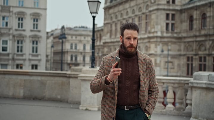Confident Businessman Navigates Urban Streets In Autumn Style