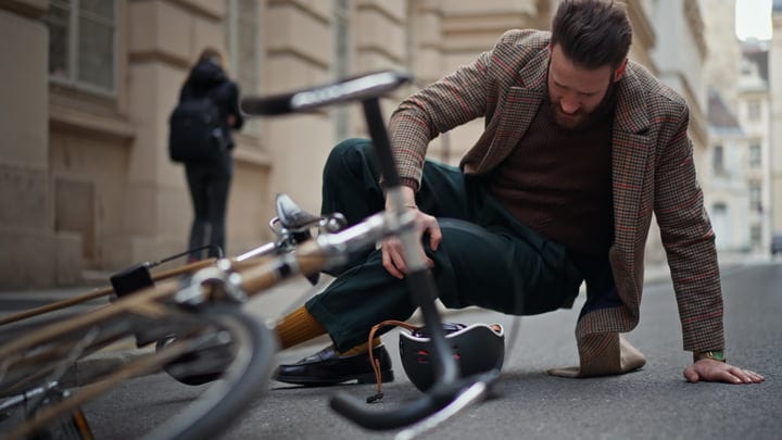 Businessman In Classic Attire Falls From Bicycle In City