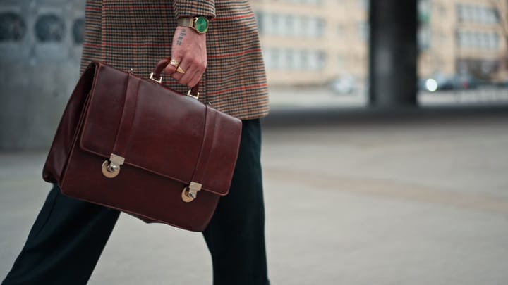 Confident Steps Of A Businessman On A City Street