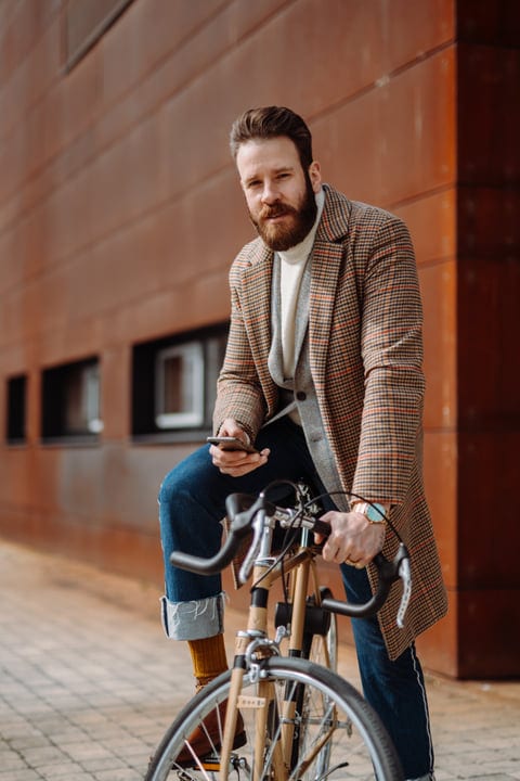 Modern Businessman Embraces Urban Cycling Commute