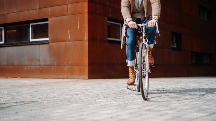 Urban Cyclist Navigates Modern Cityscape With Style