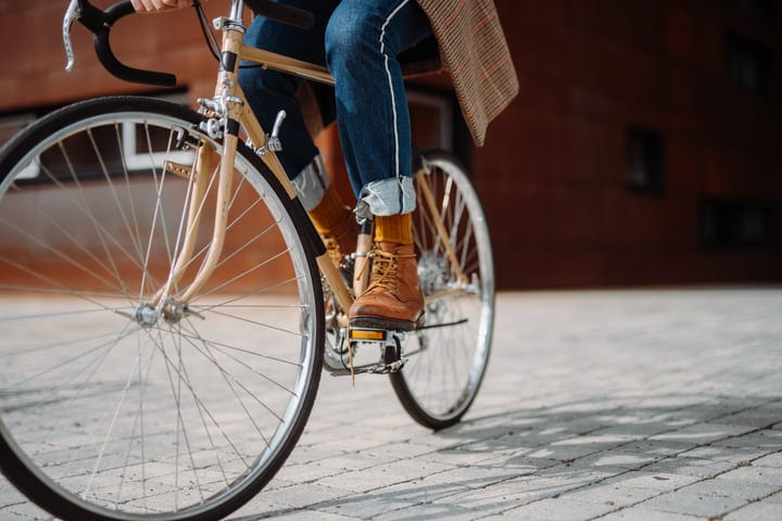 Businessman Commutes on Bicycle Through Urban Streets