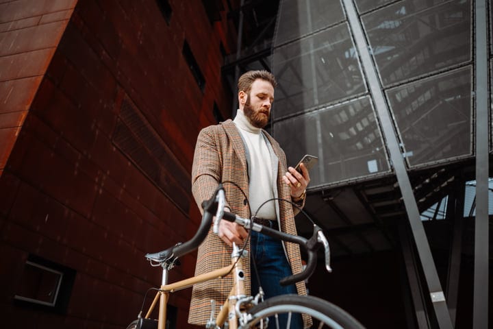 A Businessman Navigates The City With Style And Technology